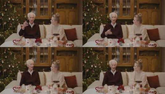 圣诞节女人和祖父在家里聊天高清在线视频素材下载