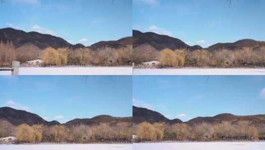 北京冬季晴朗午后结冰铺满积雪的湖面高清在线视频素材下载