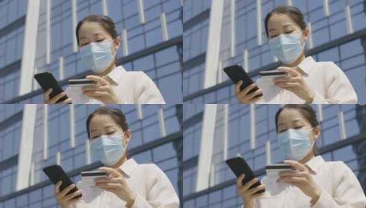 亚洲人中国女性戴口罩户外办公打电话玩手机高清在线视频素材下载