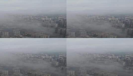 航拍云雾中的城市高清在线视频素材下载