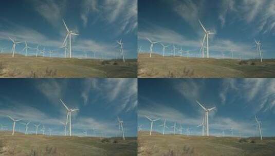 风力涡轮机在蓝天下转动高清在线视频素材下载
