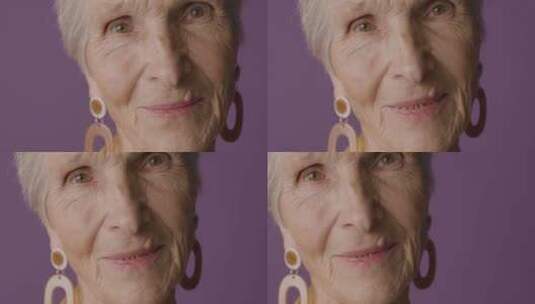 紫色背景下的老人模特高清在线视频素材下载