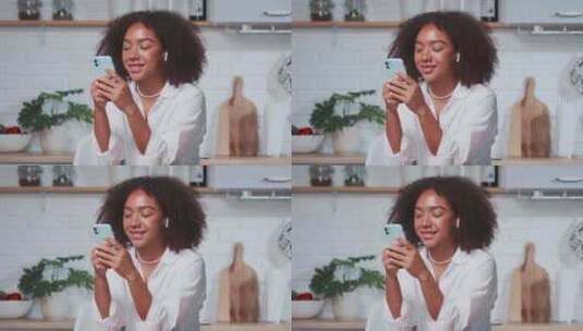 年轻的非裔美国女性通过Messenger应用程序与朋友聊天高清在线视频素材下载