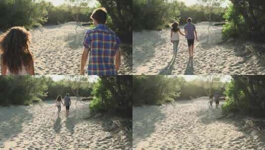 年轻夫妇沿着沙滩散步高清在线视频素材下载