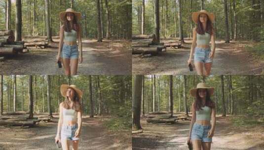 十几岁的女孩与相机在森林高清在线视频素材下载