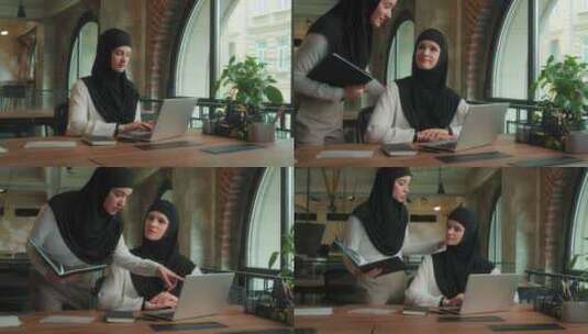 阿拉伯女商人领袖来员工帮助笔记本电脑工作高清在线视频素材下载