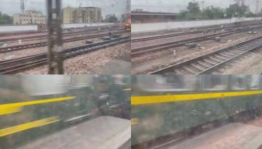 下雨天窗外火车轨道绿皮火车高清在线视频素材下载