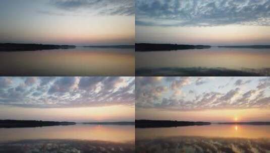清晨平静的湖面太阳和云的倒影高清在线视频素材下载