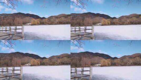 北京冬季晴朗午后结冰铺满积雪的湖面高清在线视频素材下载