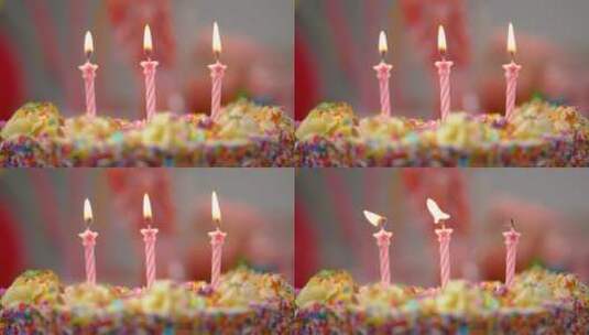 在五颜六色的蛋糕上熄灭蜡烛高清在线视频素材下载