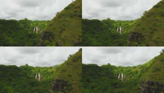 航拍丛林中的瀑布景观高清在线视频素材下载