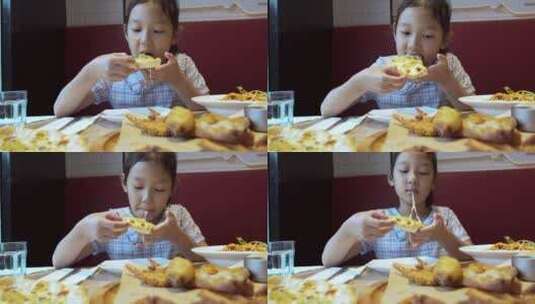 4K升格实拍在快餐厅吃披萨的女孩高清在线视频素材下载