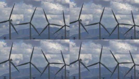 暴风雨云中旋转的风力涡轮机高清在线视频素材下载