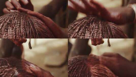 头发编织粘土辫的非洲女人高清在线视频素材下载
