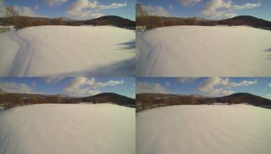 航拍蓝天白云下积雪覆盖的山峰 森林树林高清在线视频素材下载
