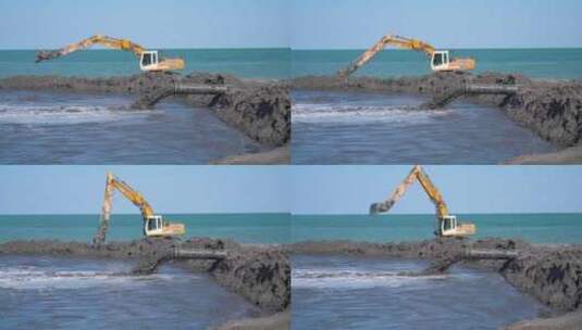 挖掘机在海滩挖掘高清在线视频素材下载