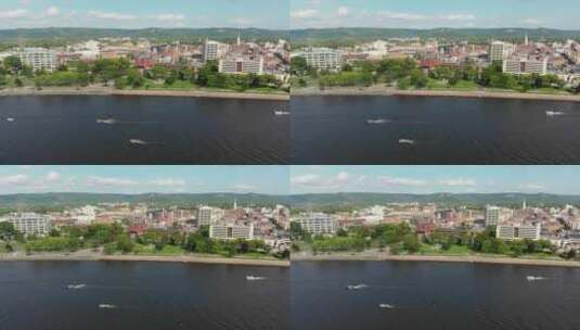 4k空中平底锅镜头从左到右的城市海岸线俯瞰拥挤的城市天际线机智高清在线视频素材下载