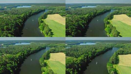 波兰森林中的一条大河上的白色小船高清在线视频素材下载