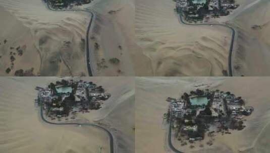 公路蜿蜒经过沙漠小镇航拍高清在线视频素材下载