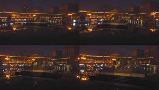 临汾冬季夜晚的鼓楼广场卧牛和城市街道灯光高清在线视频素材下载