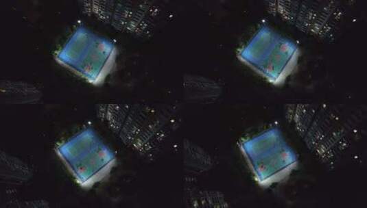 夜晚城市小区篮球场人们活动航拍高清在线视频素材下载