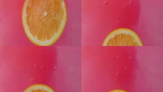 柠檬片掉进粉红色的液体中高清在线视频素材下载