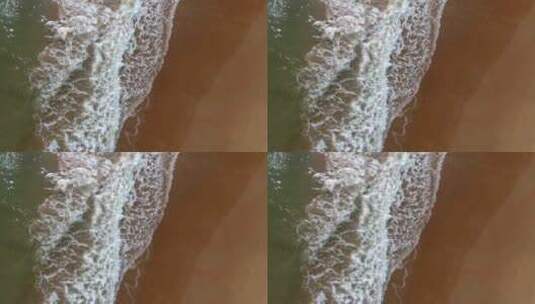 航拍海浪涌向海岸高清在线视频素材下载