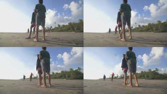 男孩在海滩上放风筝高清在线视频素材下载