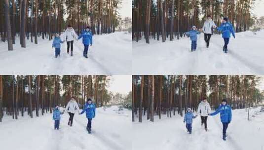 妈妈和孩子们在雪地里嬉戏散步高清在线视频素材下载