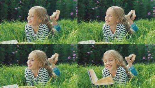 趴在在草坪上读书的女孩高清在线视频素材下载