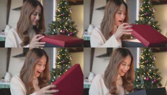 打开圣诞礼物开心的女人高清在线视频素材下载