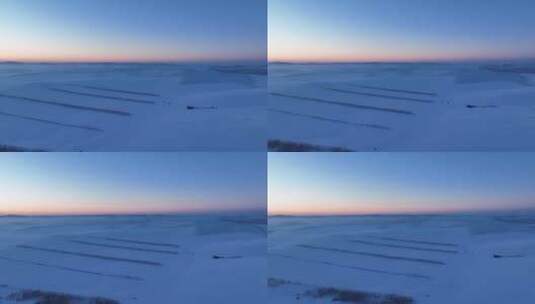 航拍内蒙古雪原雪景暮色一抹晚霞高清在线视频素材下载