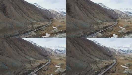 航拍新疆南疆帕米尔高原大气雪山公路景色高清在线视频素材下载