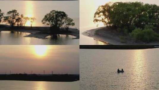航拍夕阳湖中岛屿船钓鱼树木高清在线视频素材下载