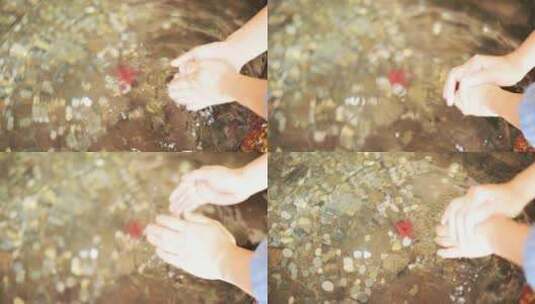 一个人在杭州径山寺洗手池洗手慢镜头高清在线视频素材下载