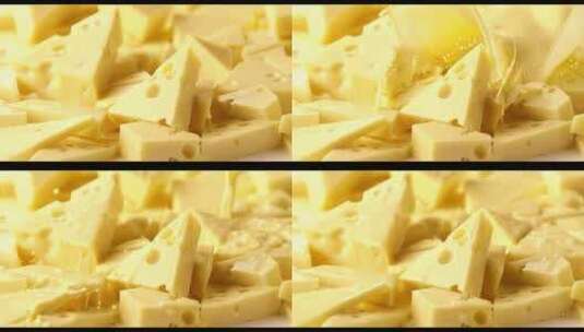 牛奶液体流动冲击翻滚奶酪芝士落入牛奶高清在线视频素材下载