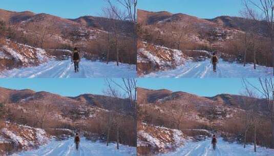 冬日有人在积雪山路行走的景象高清在线视频素材下载