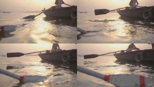 夕阳下的划船工人高清在线视频素材下载