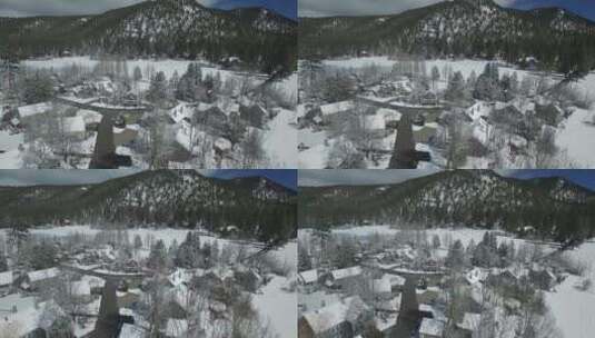无人机航拍山上白雪覆盖的村庄高清在线视频素材下载