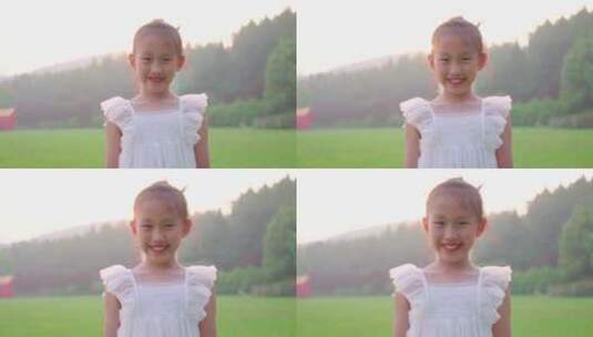阳光下穿白裙子的小女孩跳舞，小女孩笑脸高清在线视频素材下载