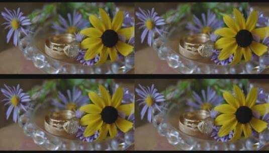 结婚戒指在小花旁边高清在线视频素材下载
