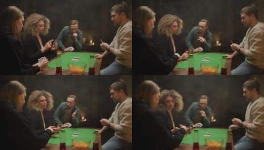 朋友围着桌子玩扑克 高清在线视频素材下载