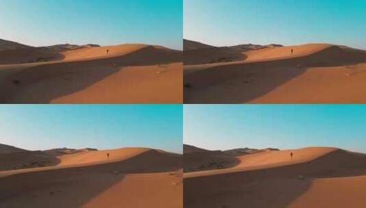 航拍人行走在沙漠高清在线视频素材下载