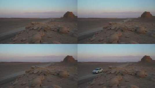 新疆哈密大海道无人区荒漠上行驶的汽车高清在线视频素材下载