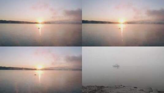 【4K航拍】暖色夕阳下湖面上渔船渔民升格高清在线视频素材下载