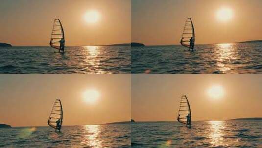 夕阳下在海上玩帆板的人无所畏惧高清在线视频素材下载