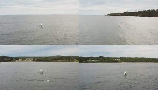 阴沉的一天，空中活动的人翼箔在苏必利尔湖冲浪高清在线视频素材下载
