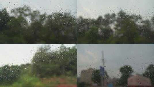 下雨天汽车玻璃窗外风景玻璃雨滴水珠高清在线视频素材下载