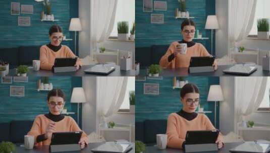 女孩开心的边喝咖啡边看电脑高清在线视频素材下载