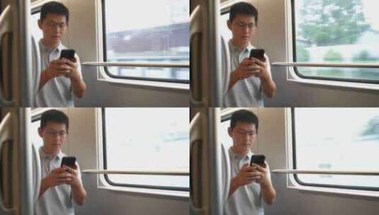 男子在卧铺火车过道上使用手机高清在线视频素材下载